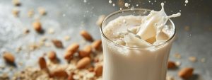 Close-up of almond milk splashing from a glass.