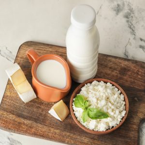 Different dairy products on light background