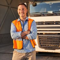 Driver standing near his truck